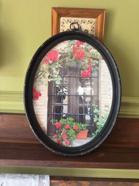 Framed Oval Wall Art with Red Floral Window Scene